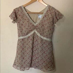 Motherhood floral blouse with flutter slee…